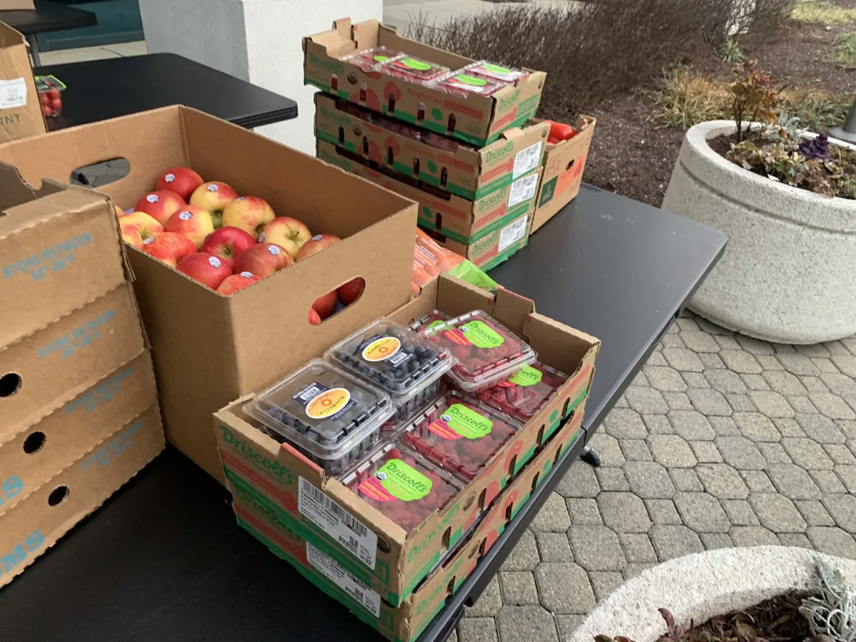 Crates of fresh apples and produce